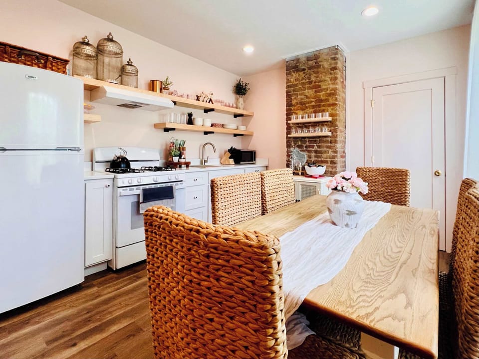 [Kitchen and Dining Area] Savor every meal in our elegant dining space.