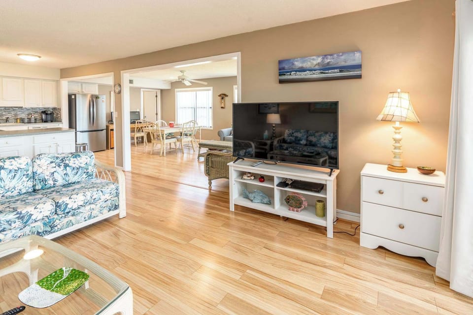 Living Room with TV, Center Table, Comfortable Seats and Deck Access with seats. 