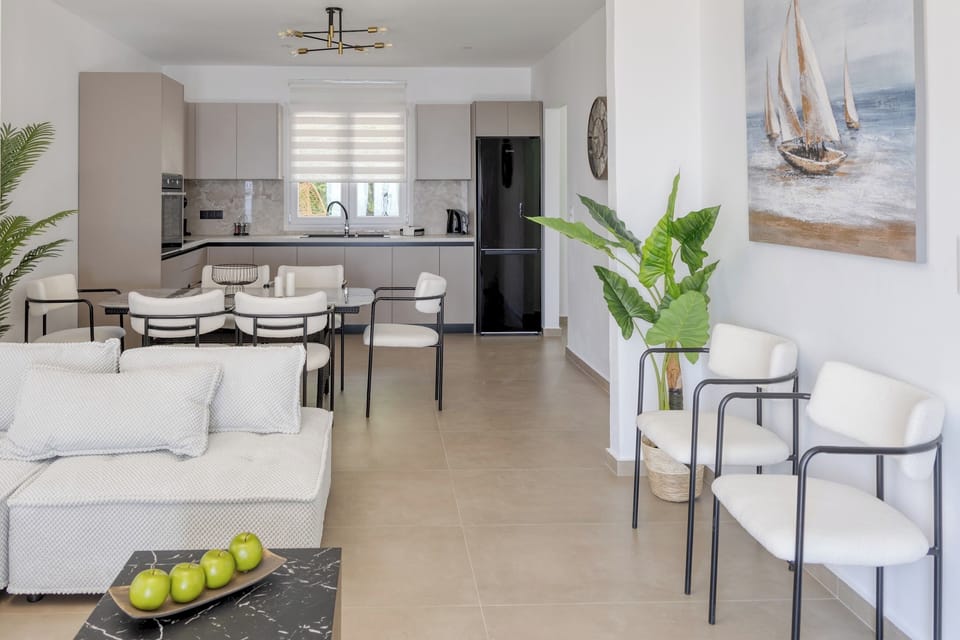 Bright open space with dining area, kitchen, and living room

