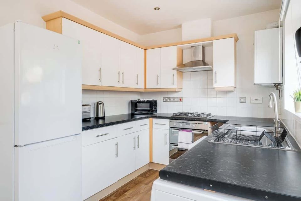 A contemporary kitchen offers all the tools and appliances needed for easy home cooking