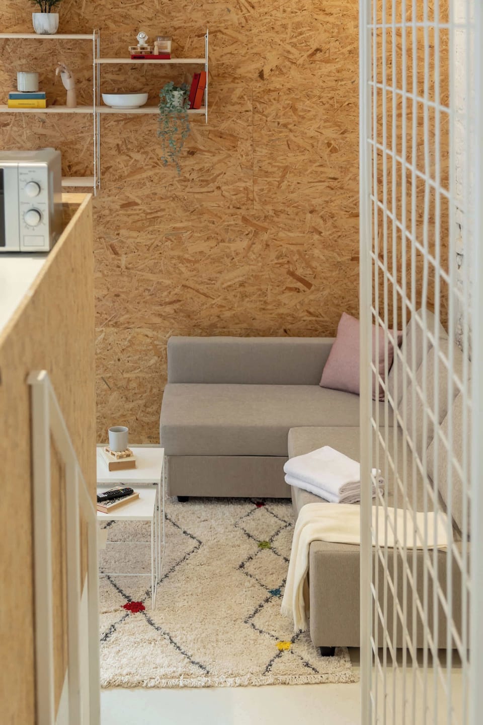 A cozy corner with soft textures, light wood and minimalist décor — a perfect spot to unwind after a day in Berlin.