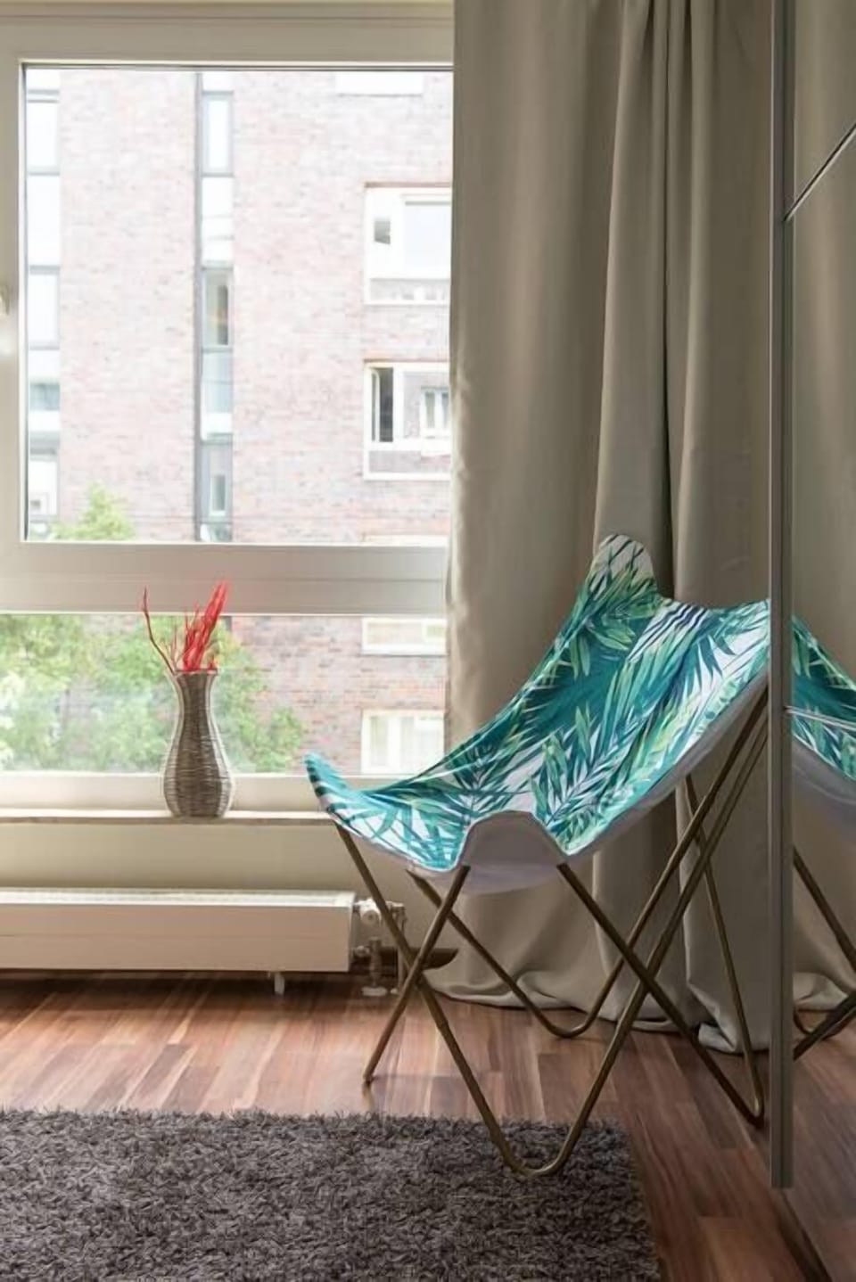 Cosy armchair to relax or to leave some clothes on it. 