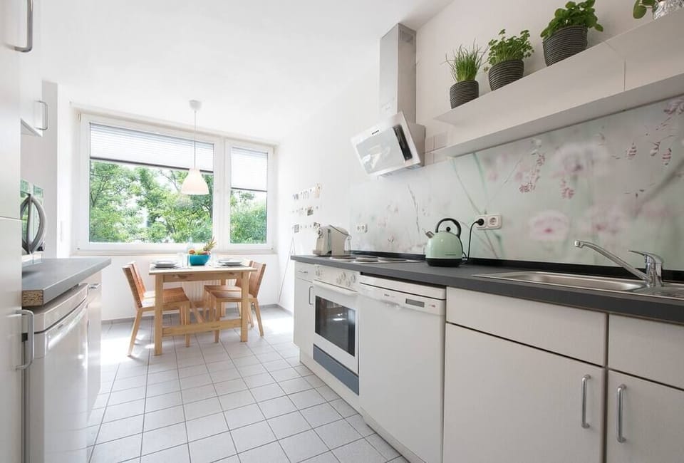 Fully equipped kitchen with an oven, stove, microwave, dishwasher, fridge, freezer, toaster, coffee machine and many more.