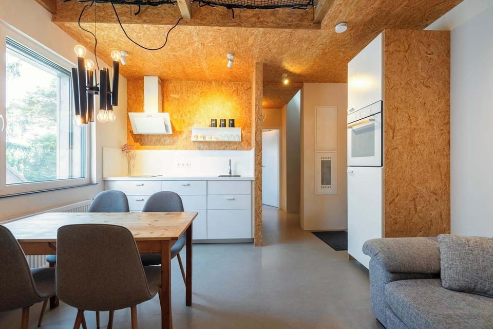 Open-plan kitchen and living space with loft character