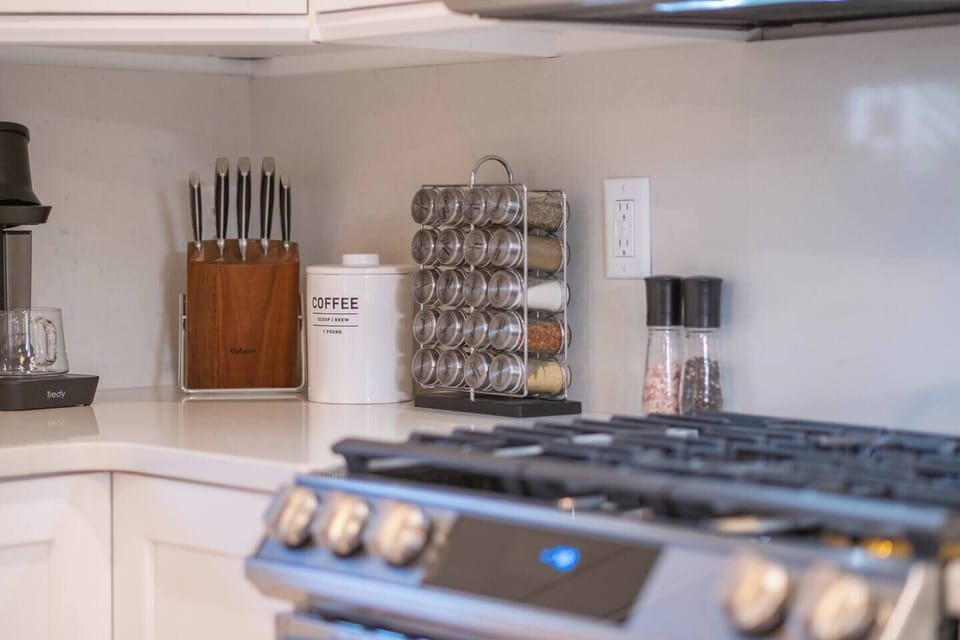 Spices, cooking, and baking utensils are all provided.
