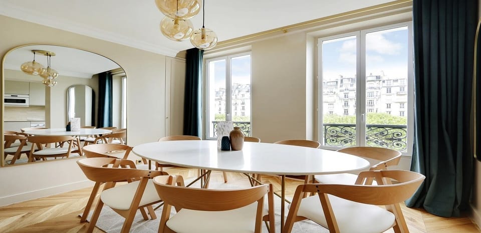 The dining area features a beautiful table perfect for 8 people.