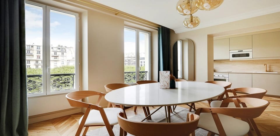 The dining area features a beautiful table perfect for 8 people. 
