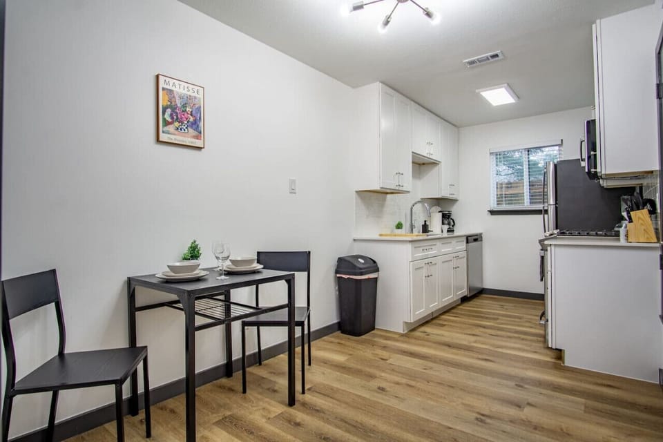 The dining room is bathed in natural light, creating a bright and inviting space where every meal feels special.