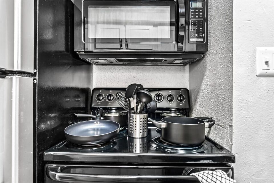 You can almost hear the sizzle of ingredients as you cook in the well-equipped kitchen, where every detail is designed for convenience.