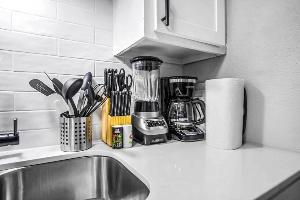 You’ll love the convenience of this fully equipped kitchen, where you can brew coffee, cook meals, or prepare snacks. The cozy layout and warm ambiance make cooking here a delightful part of your stay.