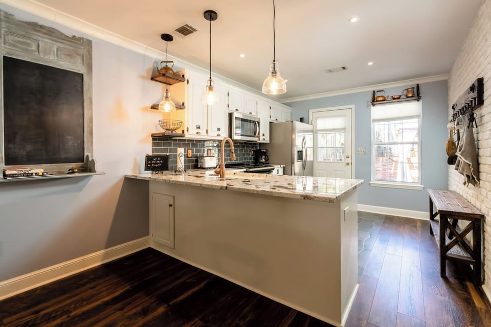 Kitchen with granite countertops and renovated appliances 