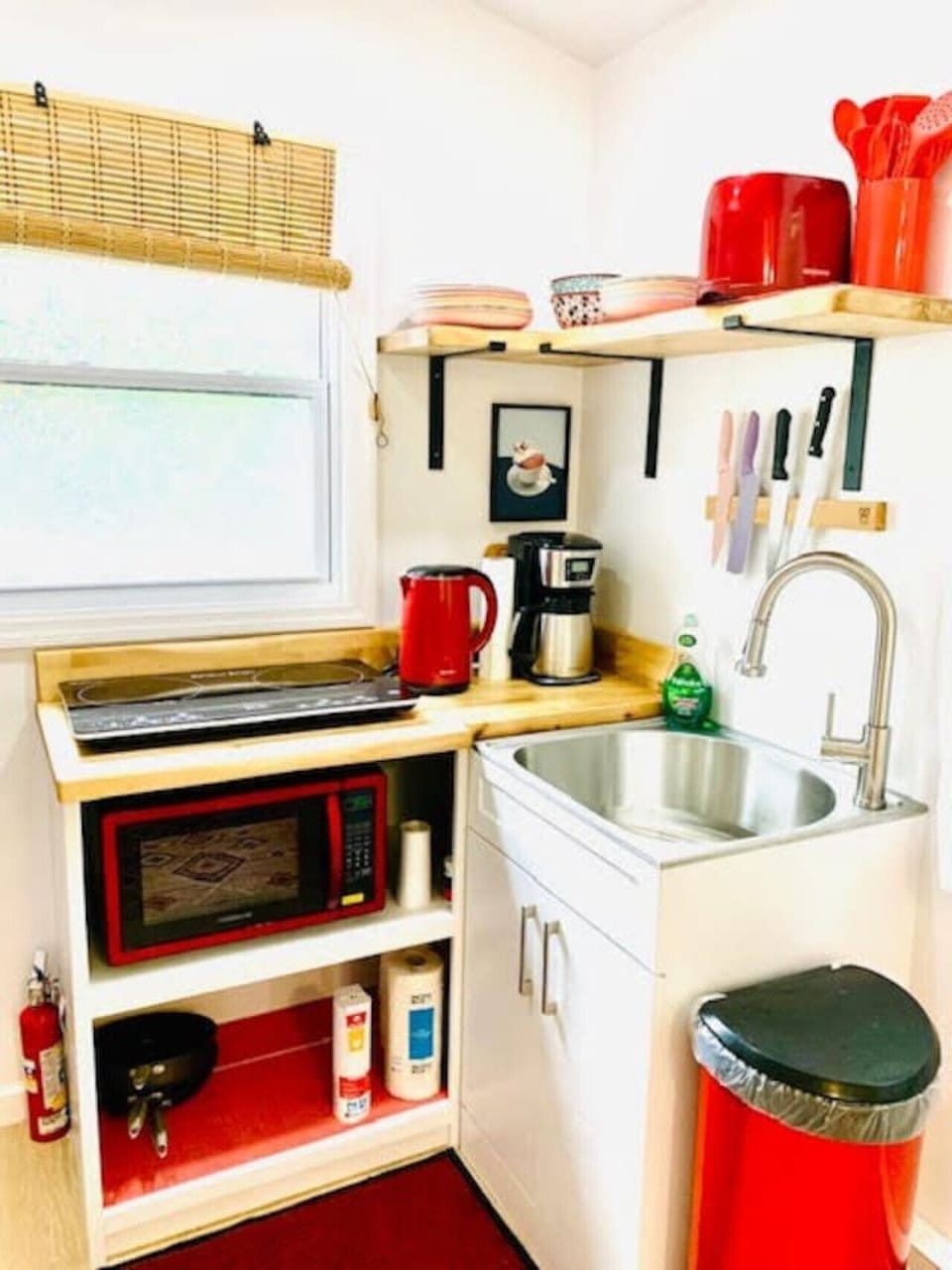 harming kitchenette equipped with an induction cooktop, coffee maker, tea kettle, toaster, and essentials for cozy mountain stays.