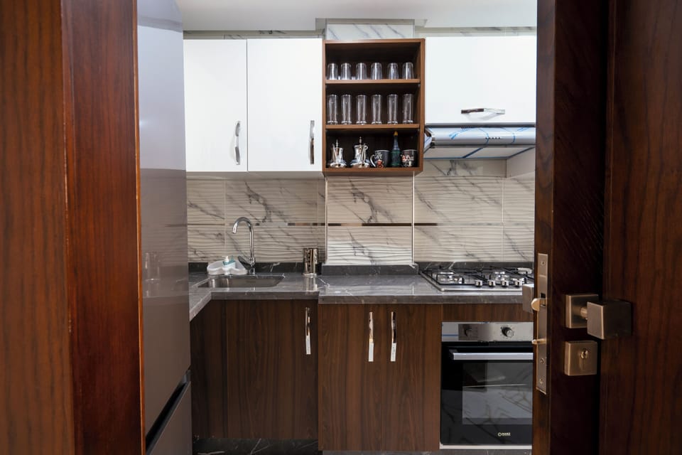Deluxe Apartment, Balcony, City View | Private kitchen | Full-size fridge, microwave, oven, stovetop