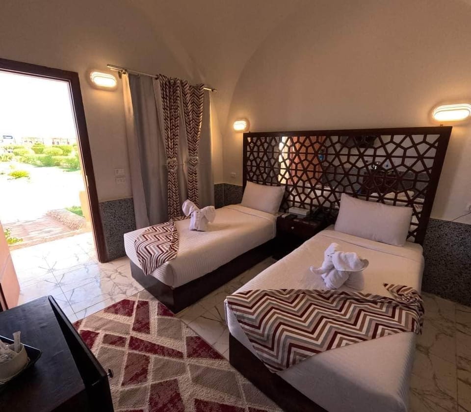Deluxe Double Room, 1 Bedroom, Partial Sea View | In-room safe, desk, blackout drapes