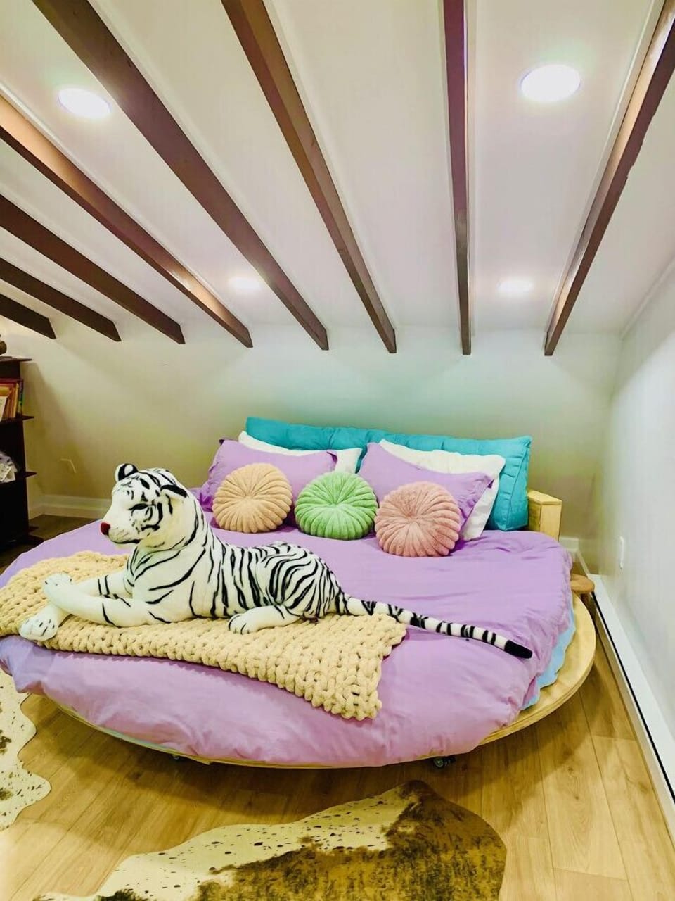 We love this custom made bed with cozy hotel style bedding.