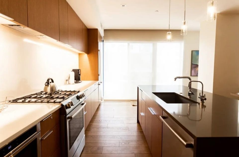 Sleek kitchen with ample counter space and natural light.