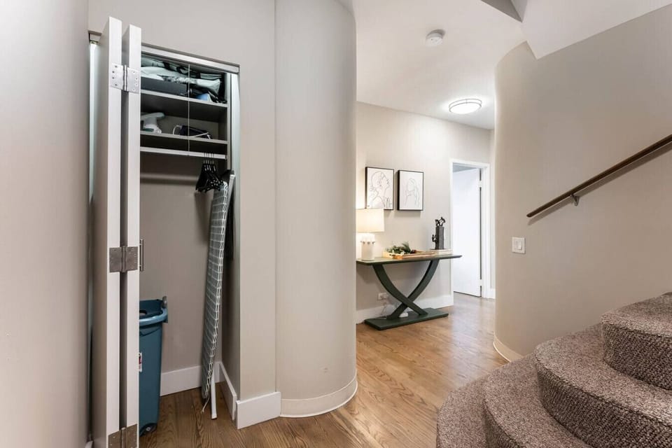 Storage closet with iron and ironing board  to use anytime. :)