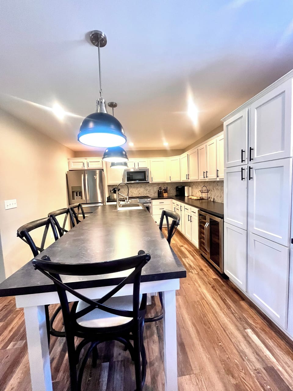 Large updated kitchen with gas stove, beverage cooler and high-end appliances. 