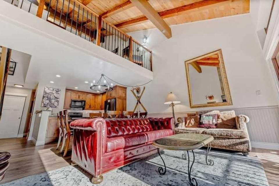 Living Room: 3-person couch, loveseat, chair, 50” Smart TV, gas fireplace, access to balcony