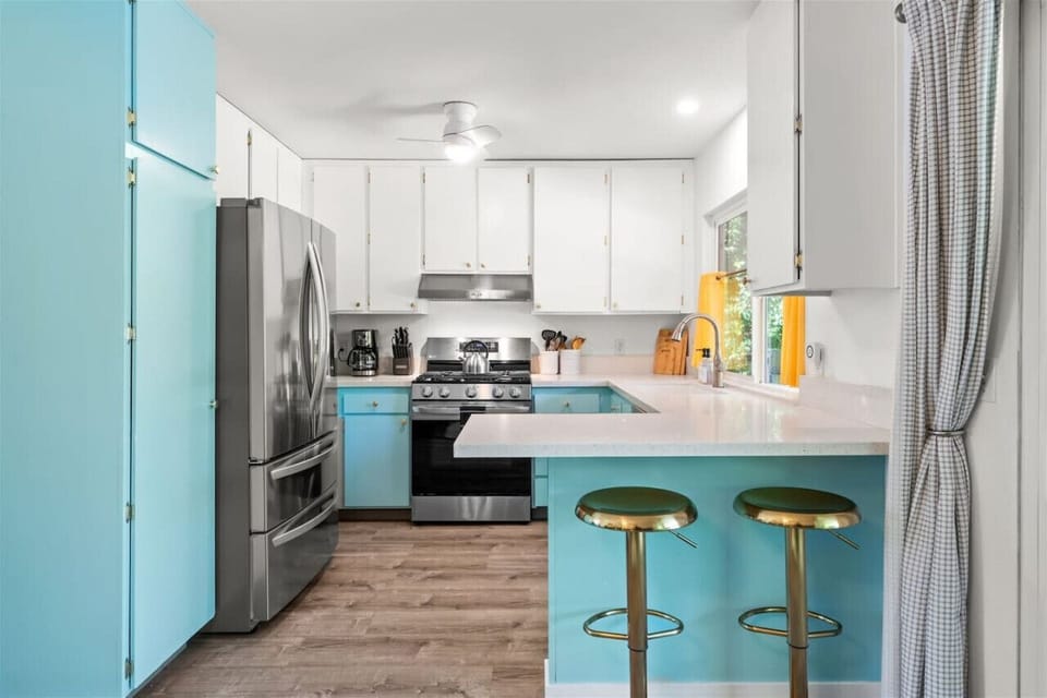 Cook in Style! 🔥🍳 With a pop of Palm Springs flair, this beautifully designed kitchen is fully stocked for your culinary adventures. Bright cabinetry, high-end appliances, and plenty of counter space make it the perfect spot for whipping up meals or enjoy