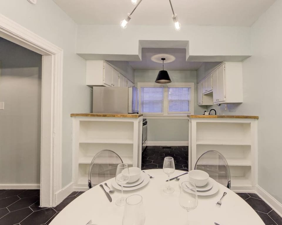 Enjoy meals and conversation in this open dining space, seamlessly connected to the kitchen for a relaxed and social atmosphere.