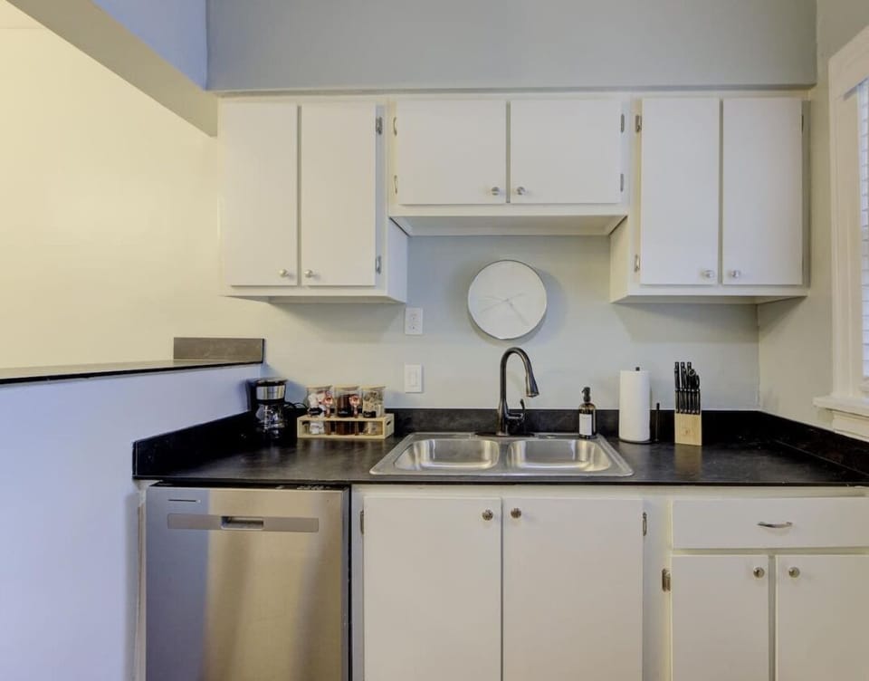 A kitchen that’s both stylish and functional, complete with modern fixtures and thoughtful amenities.