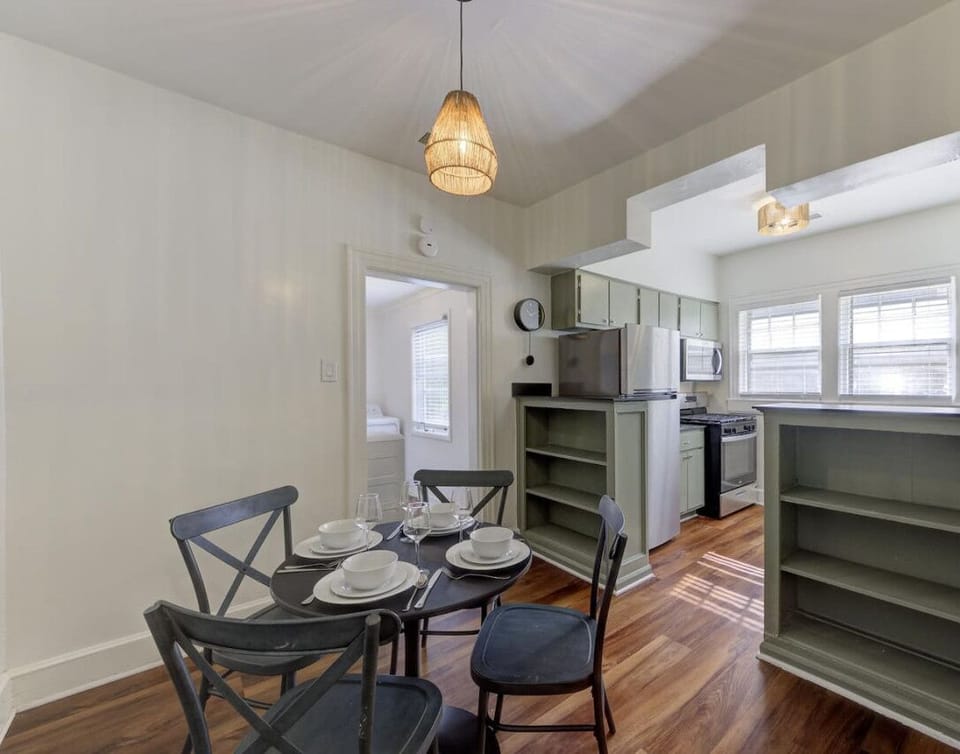 Start your day with coffee in this cozy dining area, where modern comfort meets practical design, just steps from your bedroom and kitchen.