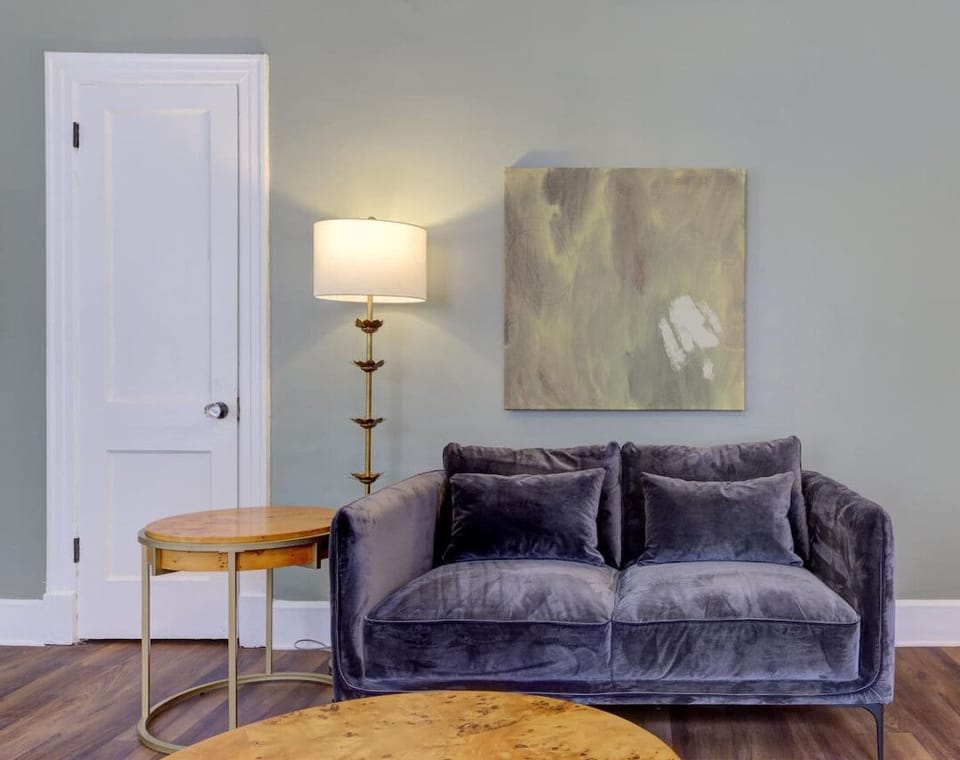 Relax in style on this plush velvet loveseat, perfect for unwinding after a day of exploring Memphis.