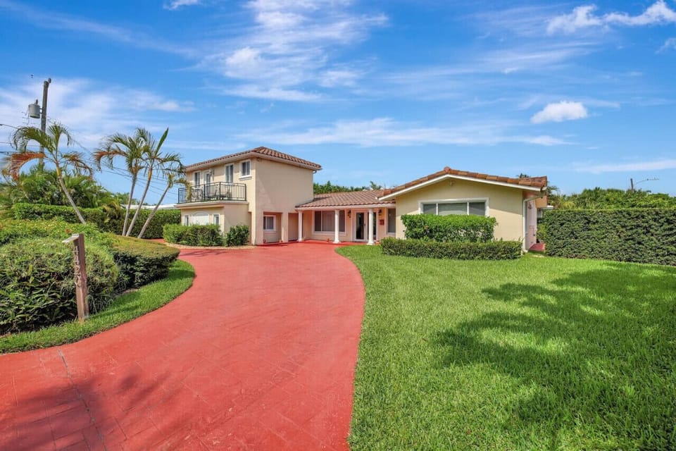 Exterior photo of the duplex. The listing is for the main house on the right side