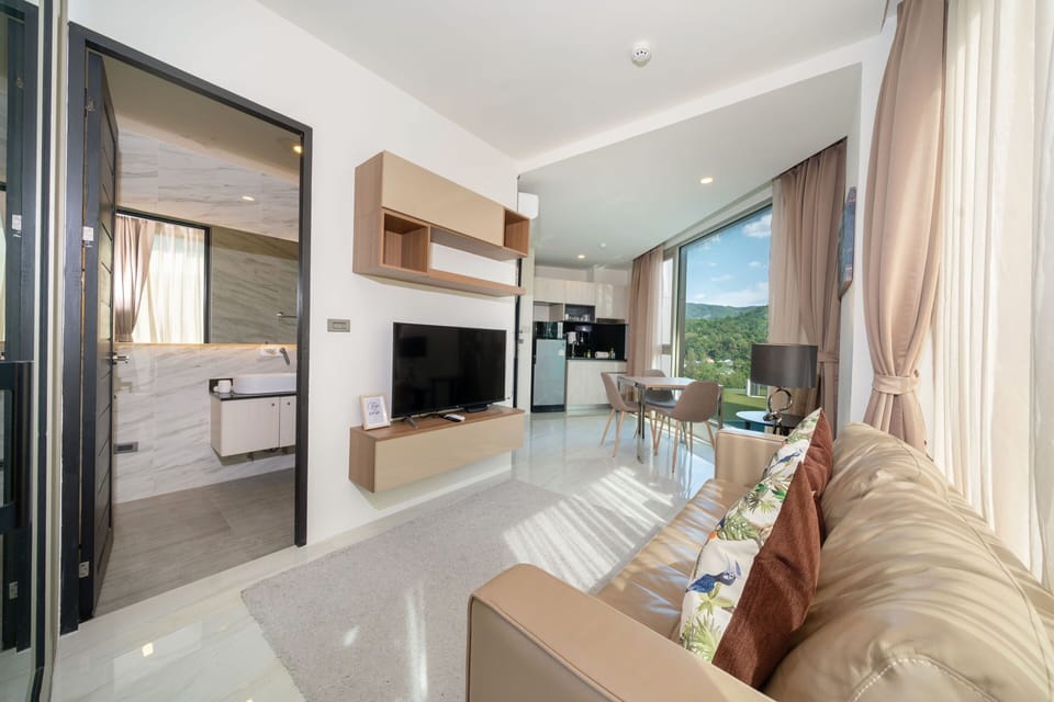 Exclusive Apartment, Balcony, Partial Sea View | Living area | Flat-screen TV