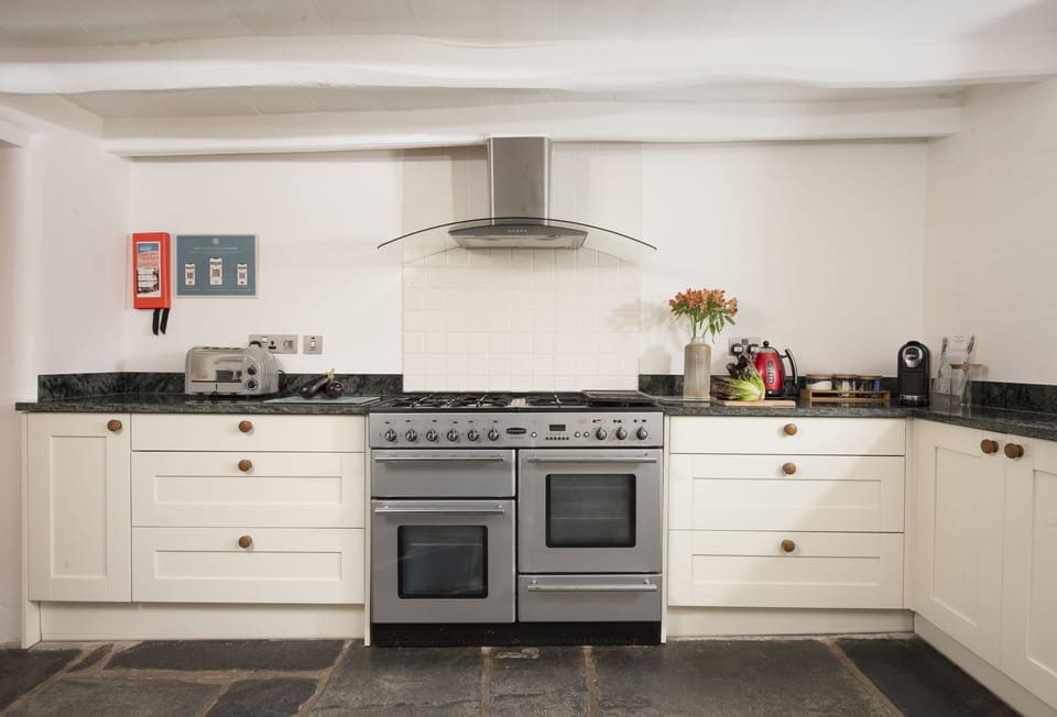 The Old Farmhouse, Duloe, Liskeard. Ground Floor:  The kitchen comes fully equipped with everything you'll need to cook up family dinners, including a large electric range cooker
