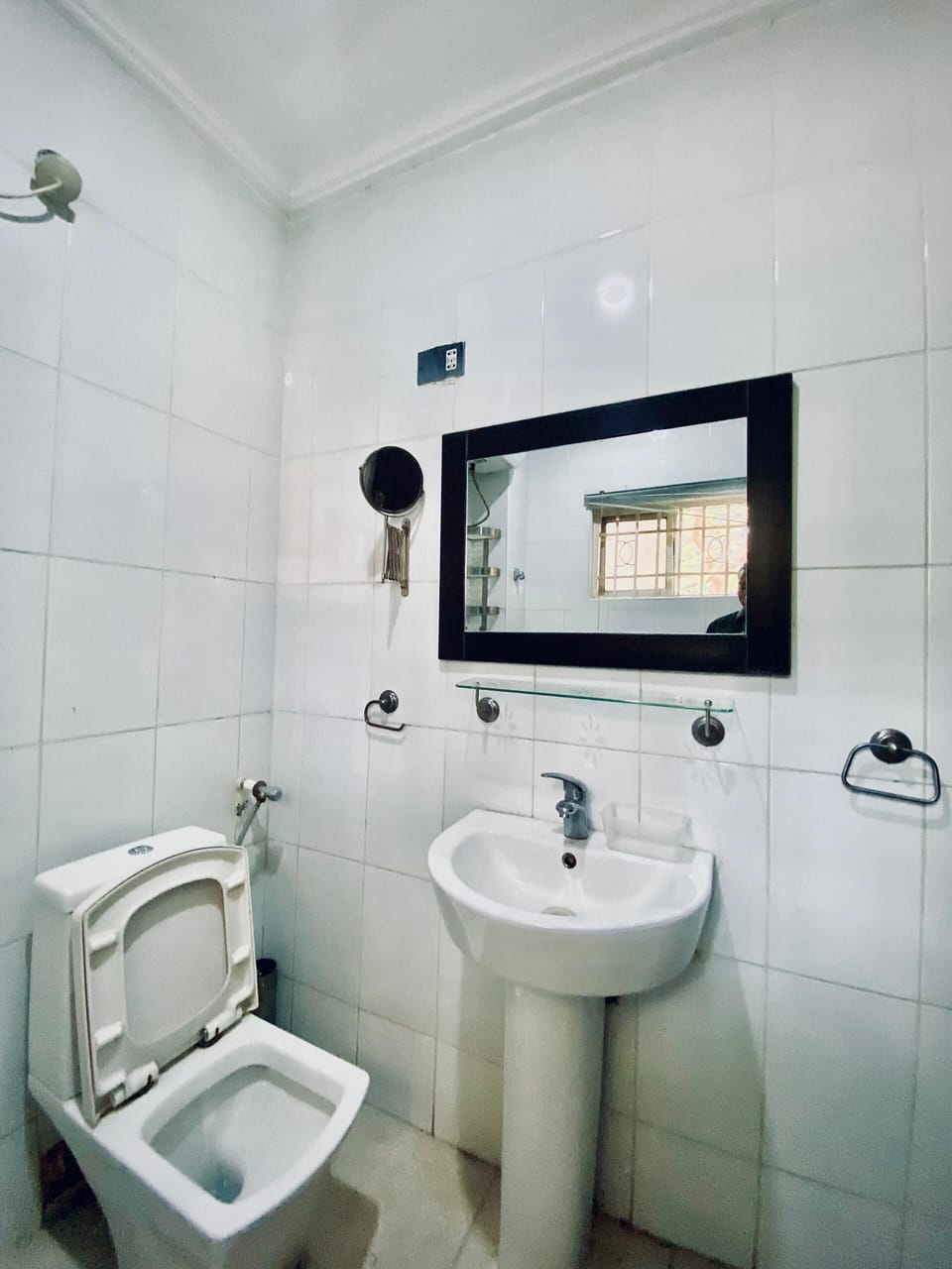 Economy Studio Suite | Bathroom | Towels, soap, toilet paper