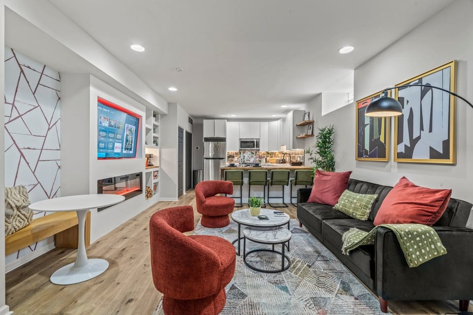 Gather in this vibrant living space — where bold colors, comfort, and connection come naturally.