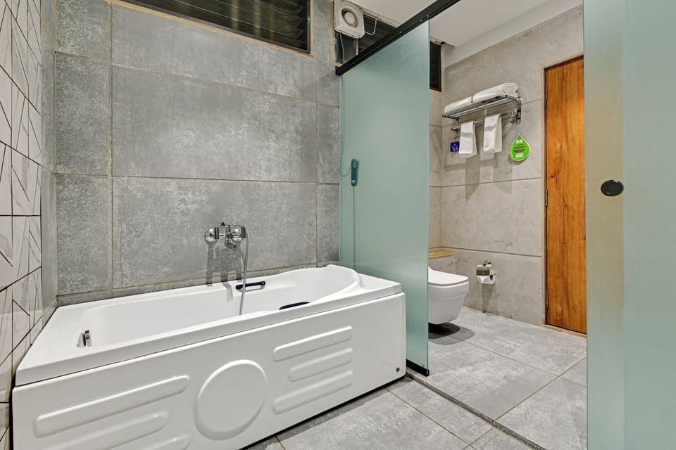 Studio Suite, City View | Bathroom | Shower, slippers, towels, soap