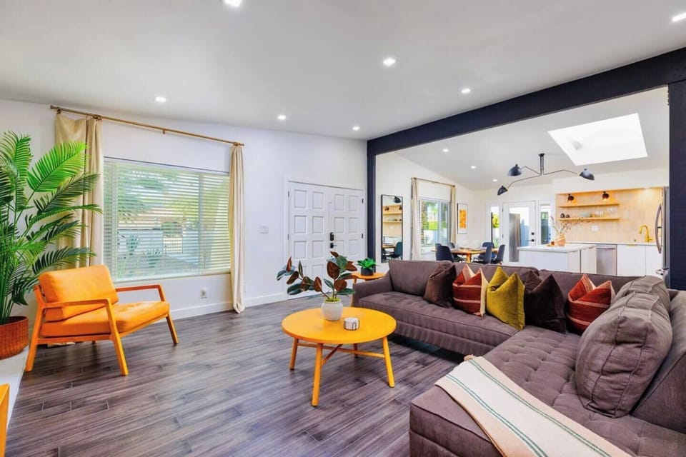 The living room offers plenty of comfortable seating for everyone to relax and enjoy.