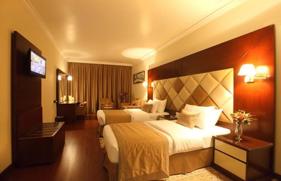 Deluxe Double Room, City View | Minibar, in-room safe, desk, laptop workspace