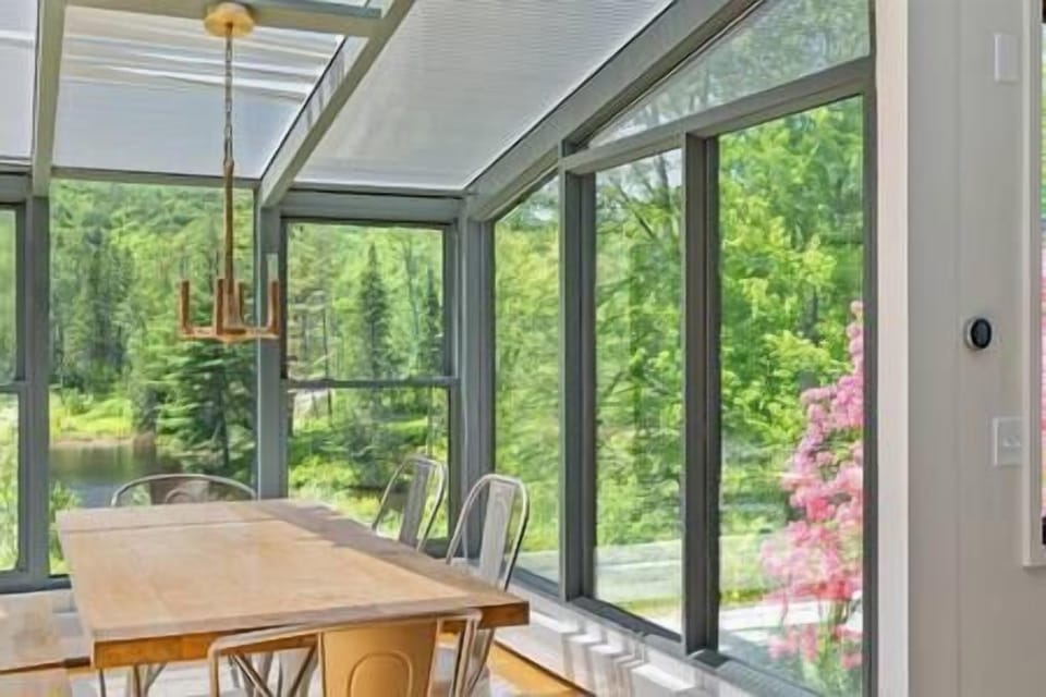 Glassed in dining space means views all around to the outdoors.