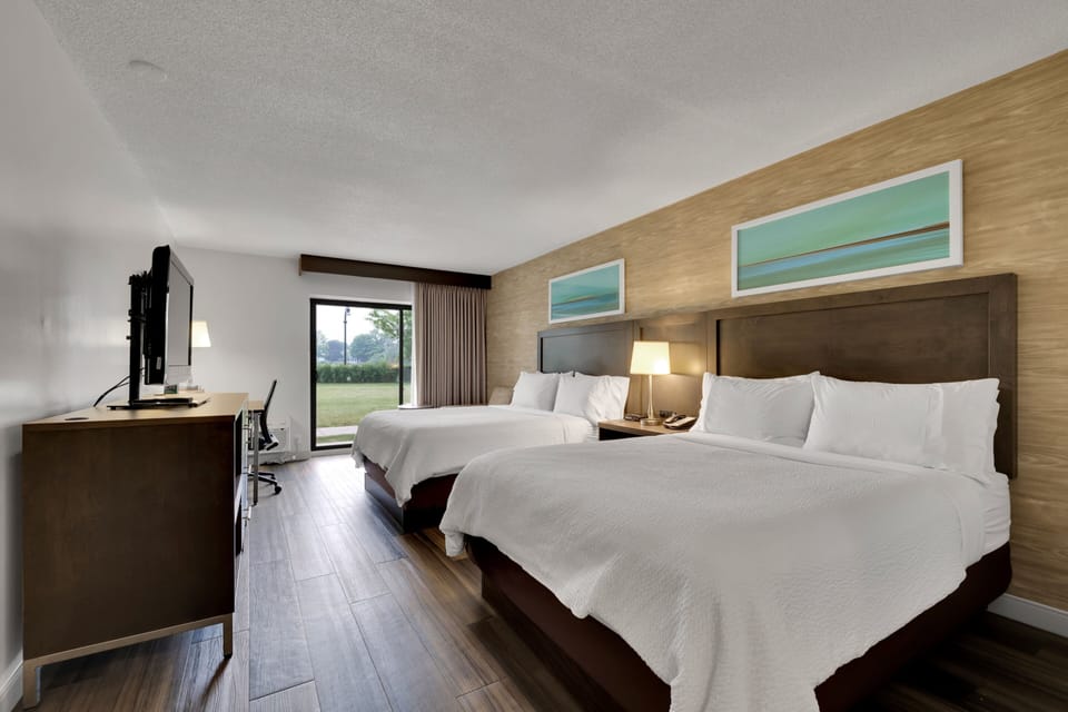 Standard Room, 2 Queen Beds, Courtyard View | Desk, soundproofing, iron/ironing board, free cribs/infant beds