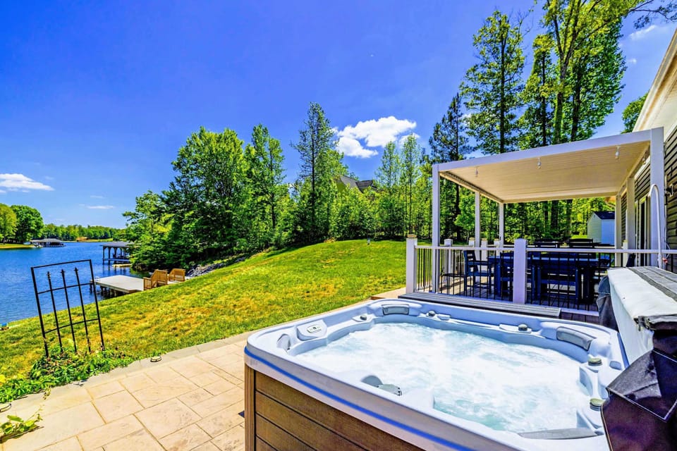 Hot Tub - Soak with a lake view in front and the louvered pergola at your back, the best seat in the yard.