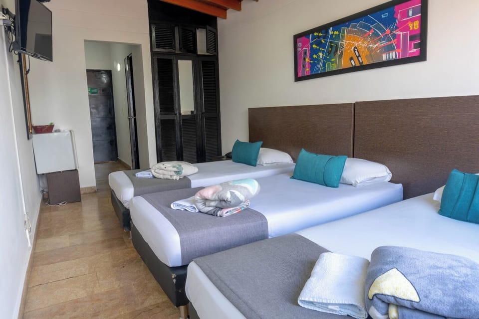 Classic Quadruple Room, City View | In-room safe, desk, iron/ironing board, free WiFi
