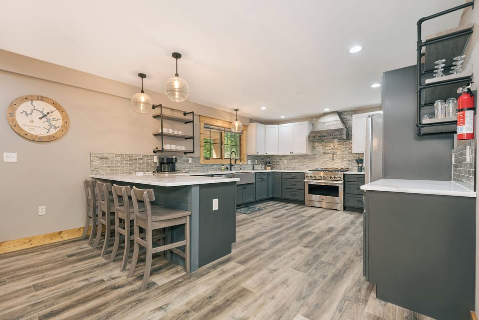 The kitchen has a microwave, dishwasher, and gas stove/oven.