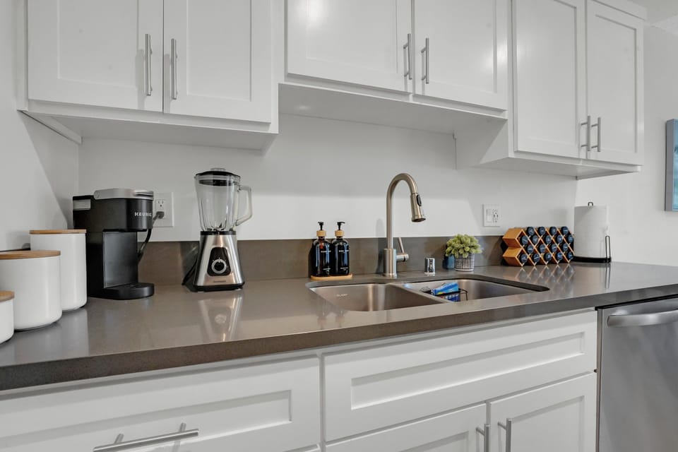 Full Kitchen with blender, coffee maker, dish soap, creamer and coffee