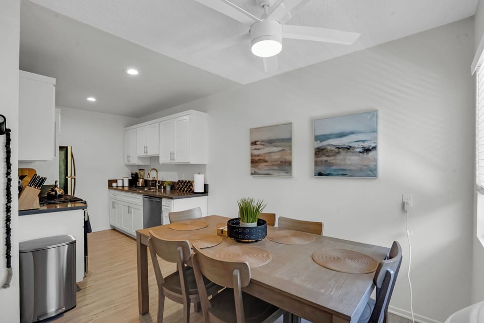 Wooden Dining Table opening up to the kitchen