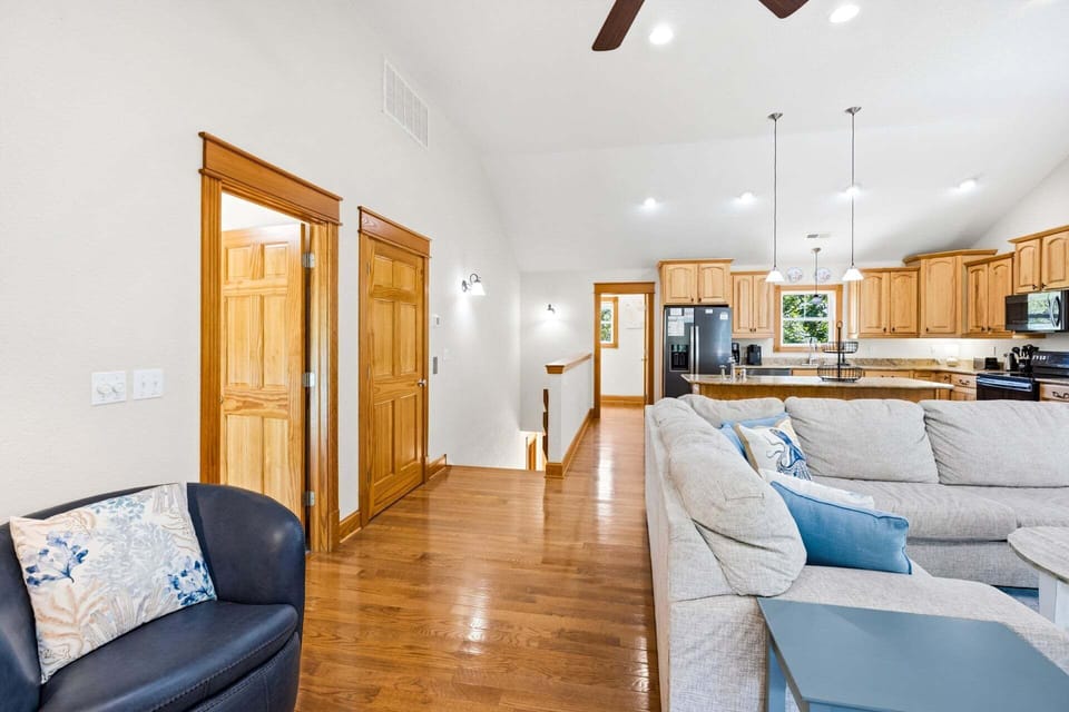 The spacious Living Area, complete with a gas fireplace, invites cozy gatherings.