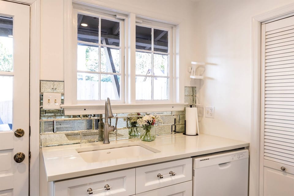 Watch your family catch up on the back patio outside from the kitchen. The laundry is in the closet to the right of the sink.