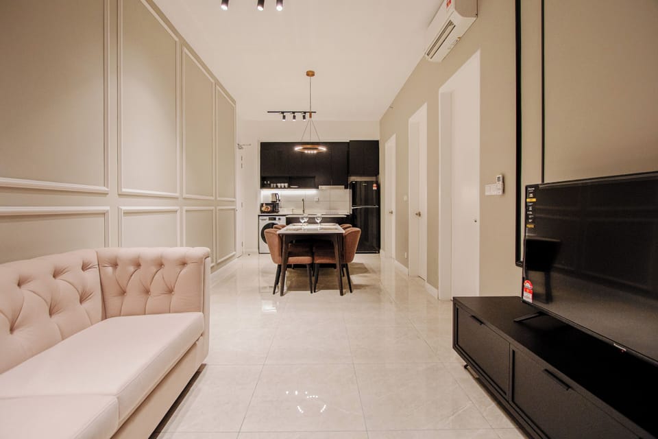 Deluxe Apartment, 3 Bedrooms, City View | Living area | 50-inch LED TV with digital channels