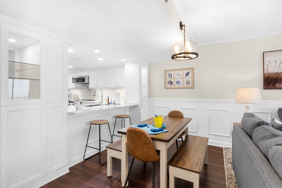 The dining area offers a dining table as well as bar seating