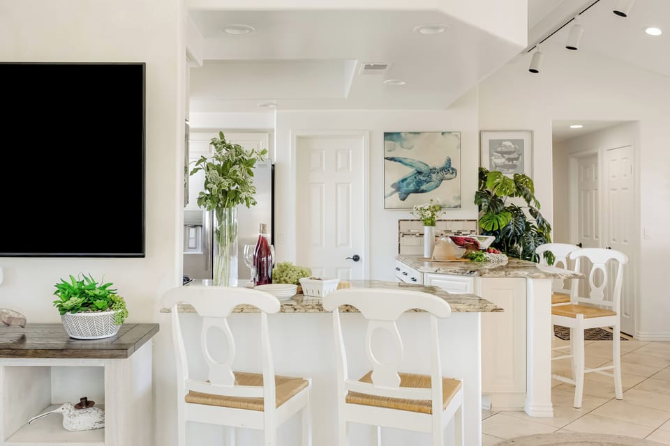 Kitchen features barstool seating.