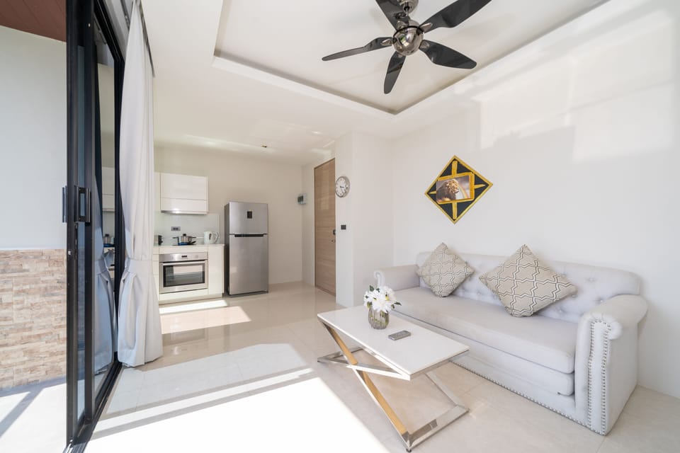 Exclusive Apartment, Balcony, Partial Sea View | Living area
