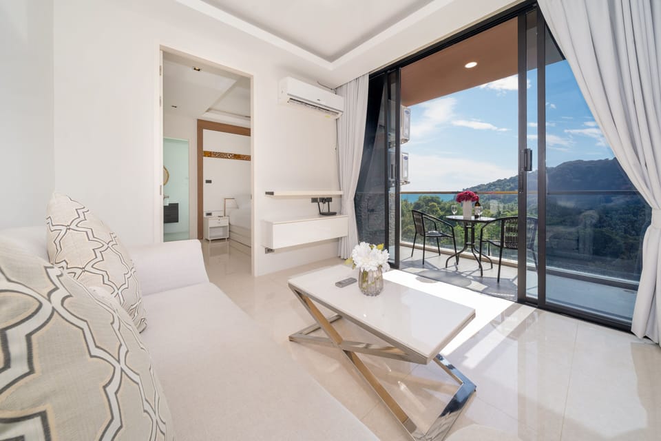 Exclusive Apartment, Balcony, Partial Sea View | Living area